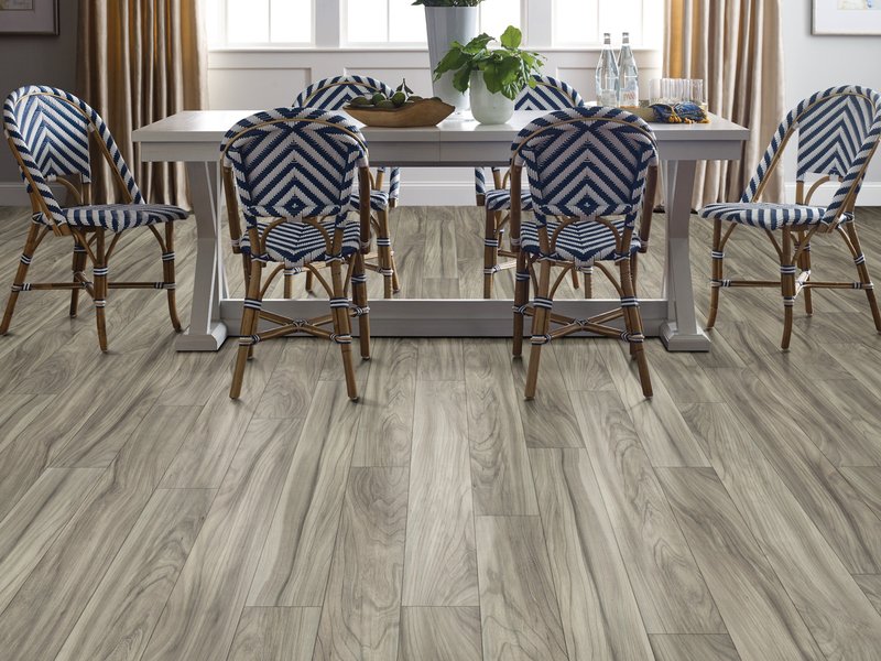 Dining room with wood-look laminate flooring from Carpet City & Flooring Center in the Fairfield, CT area