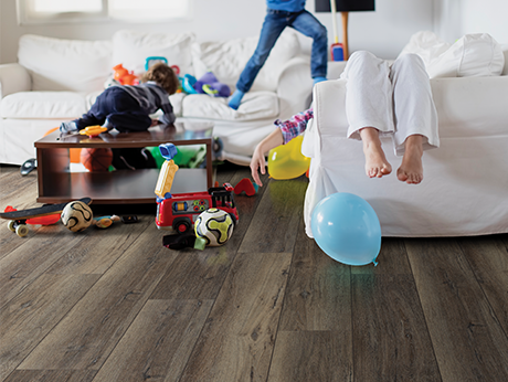 kids playing in room with wood-look laminate flooring from Carpet City & Flooring Center in the Fairfield, CT area